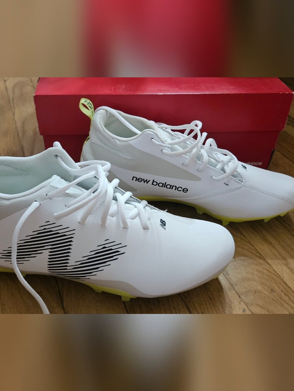 New Balance Men's White Athletic Cleats with Lime Accents
